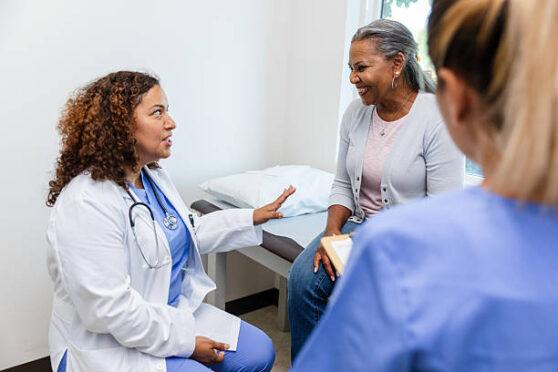 Female doctor listening to a patient during a medical consultation.